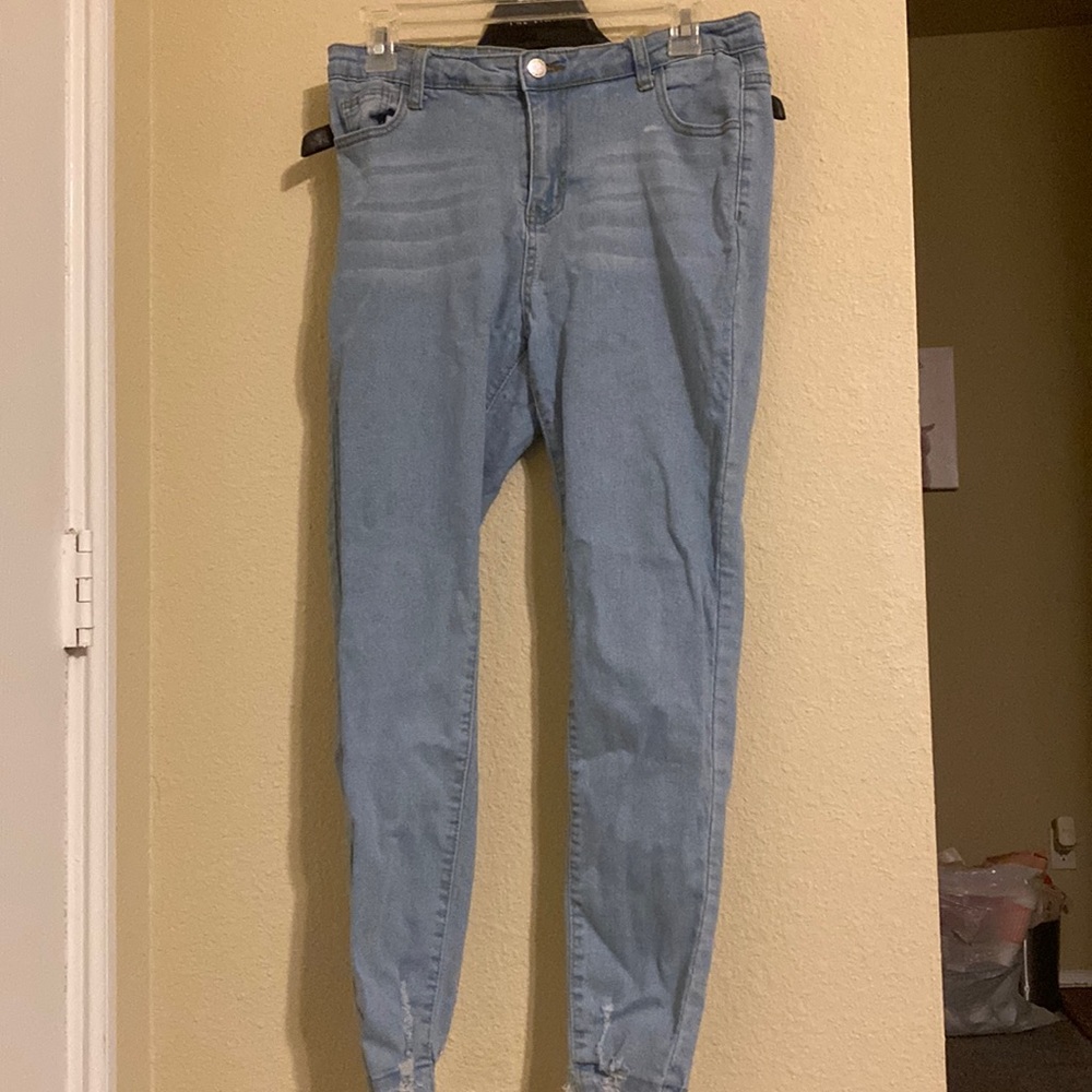 Blue jeans ripped at ankle